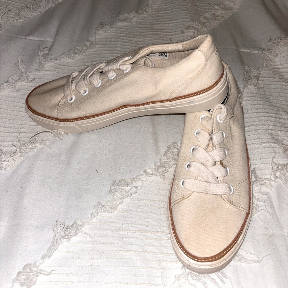 Tom’s shoes in cream
